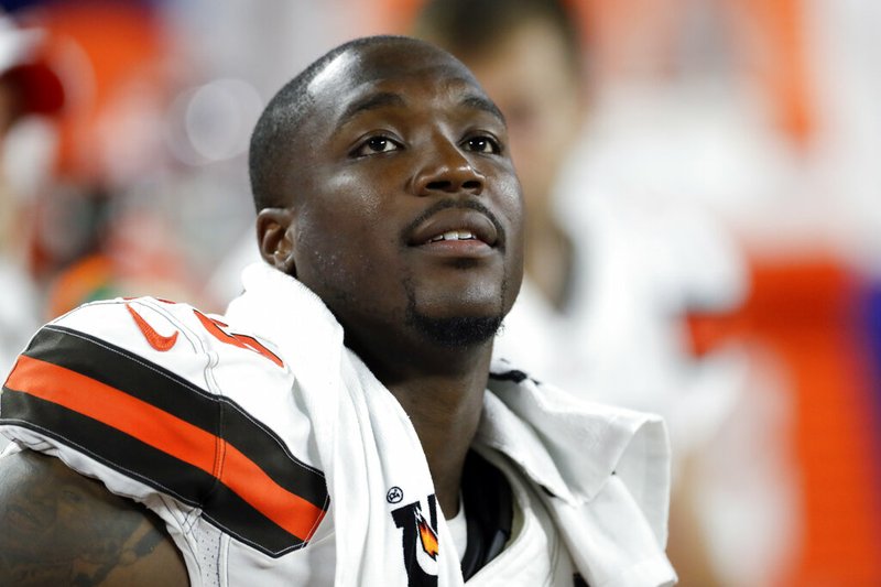 In this Aug. 8, 2019, file photo, Cleveland Browns defensive end Chris Smith (50) sits on the sideline during the first half of an NFL preseason football game against the Washington Redskins in Cleveland. Petara Cordero, the girlfriend of Smith has been killed in an accident early Wednesday, Sept. 11, 2019. The team said Cordero, 26, died when she was struck by an oncoming car on I-90 West at around 2 a.m. after she and Smith had pulled to the side of the road when the car he was driving had a tire malfunction and spun out. (AP Photo/Ron Schwane, File)