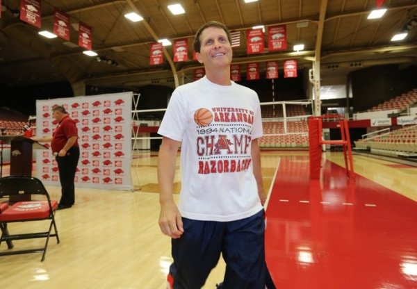 Arkansas men's basketball coach Eric Musselman exits a news conference on the floor at Barnhill Arena in Fayetteville on Thursday. On Wednesday, the program announced it would play its annual preseason Red-White scrimmage in Barnhill Arena on Oct. 5 and 3 p.m.