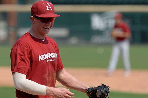Arkansas' Heston Kjerstad warms up Friday, Sept. 6, 2019, during practice at Baum-Walker Stadium in Fayetteville.