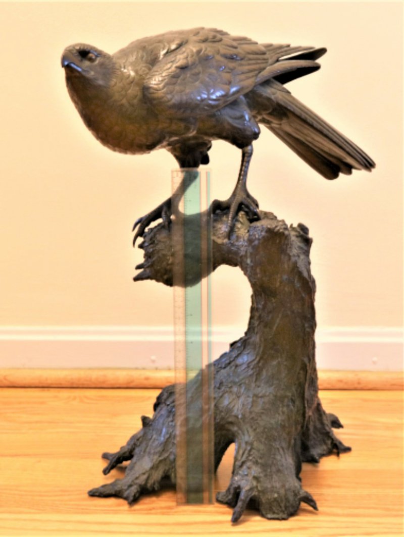 Imposing cast iron bird sculpture looks Japanese