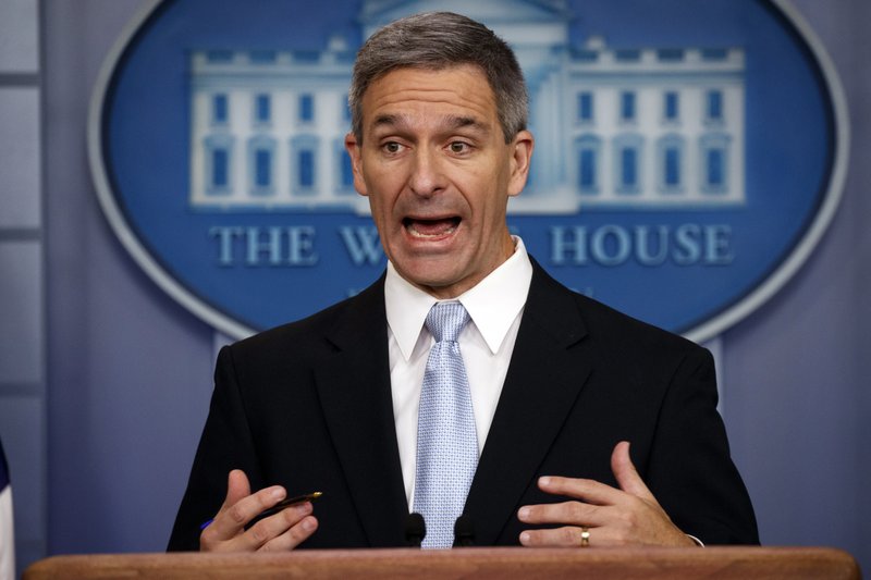 FILE - In this Aug. 12, 2019, file photo, acting Director of United States Citizenship and Immigration Services Ken Cuccinelli speaks during a briefing at the White House, Monday, Aug. 12, 2019, in Washington. Cuccinelli defended the effort to effectively end asylum at the U.S.-Mexico border for nearly all migrants, saying Frida, Sept. 13 it was necessary to drive down a massive backlog of immigration cases. (AP Photo/Evan Vucci, File)