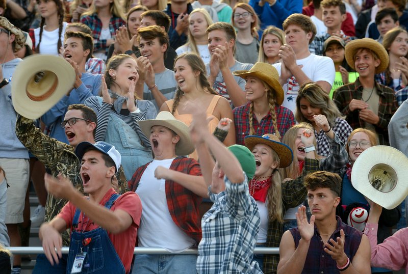 NWA Democrat-Gazette/ANDY SHUPE Springdale Har-Ber students celebrate Friday, Sept. 13, 2019, before the start of the first half against Russellville at Wildcat Stadium in Springdale. Visit nwadg.com/photos to see more photographs from the game.