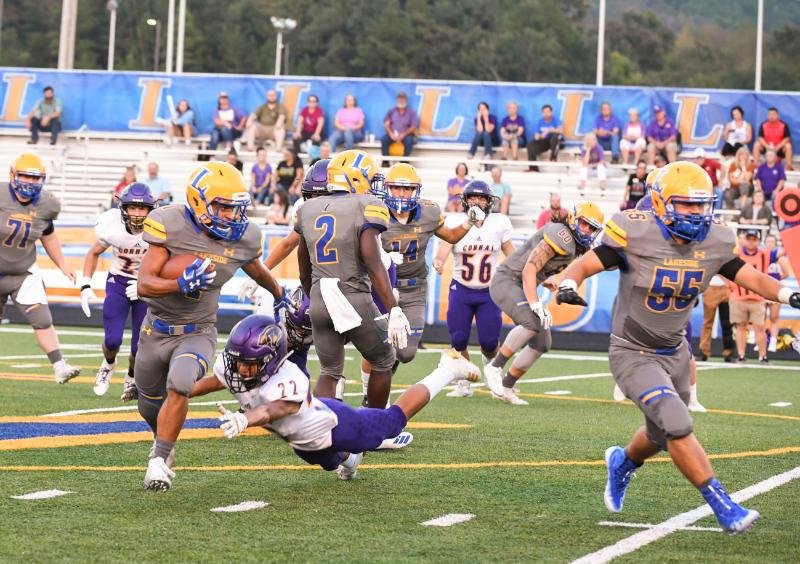 The Sentinel-Record/Grace Brown Lakeside junior running back Isaac Echols (1) avoids a tackle as he turns up the field in Friday's 35-14 win over Fountain Lake at Chick Austin Stadium.