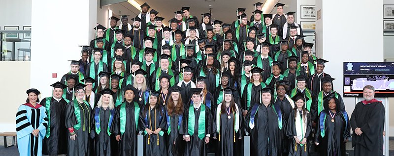 The Arkansas Career Training Institute’s final residential class stands at commencement services Friday at the Hot Springs Convention Center. - Photo by Richard Rasmussen of The Sentinel-Record