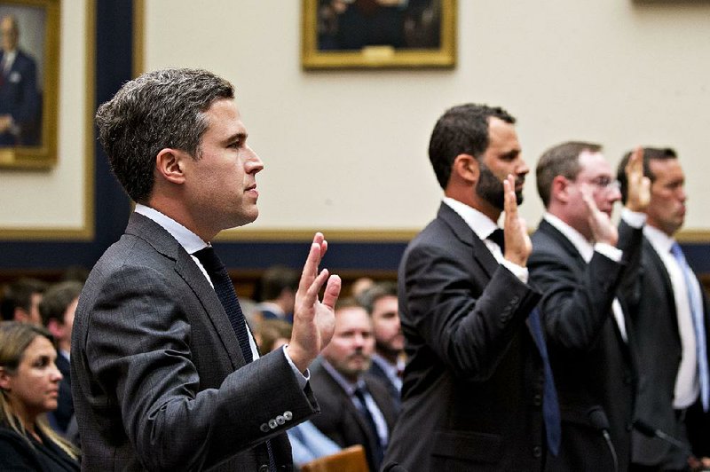 Executives Adam Cohen of Google Inc. (from left), Matt Perault of Facebook Inc., Nate Sutton of Amazon.com Inc. and Kyle Andeer of Apple Inc. are sworn in at a House antitrust subcommittee hearing in July. 