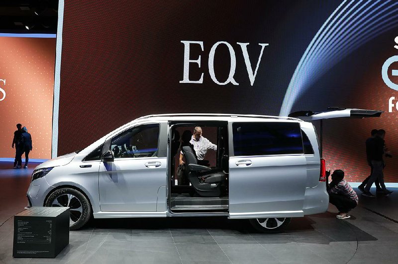 Attendees inspect a Mercedes-Benz EQV electric van in the Daimler AG exhibition hall last week at the IAA Frankfurt Motor Show in Frankfurt, Germany. 