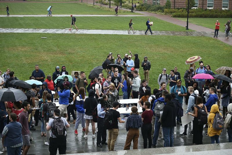 Students gather for a protest Friday at Liberty University in Lynchburg, Va. 