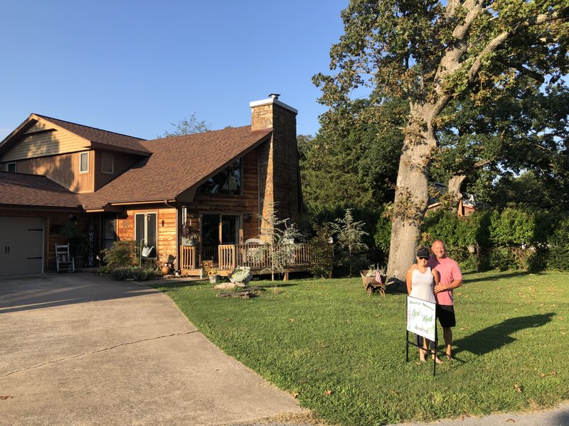 Courtesy photo Darrell Allison and Kellie Cryder Allison, 6532 Willow Drive in Rogers, have been selected as the Beaver Shores POA Yard of the Month for September. The Allisons moved to Beaver Shores in July 2018. They have been working on their landscaping this past year and have Atlas trees, Japanese maples, salvia, hostas, ferns, licorice, English ivy, and purple juke in their yard. Sponsor for the award is Bradford Yard Living + Landscape.