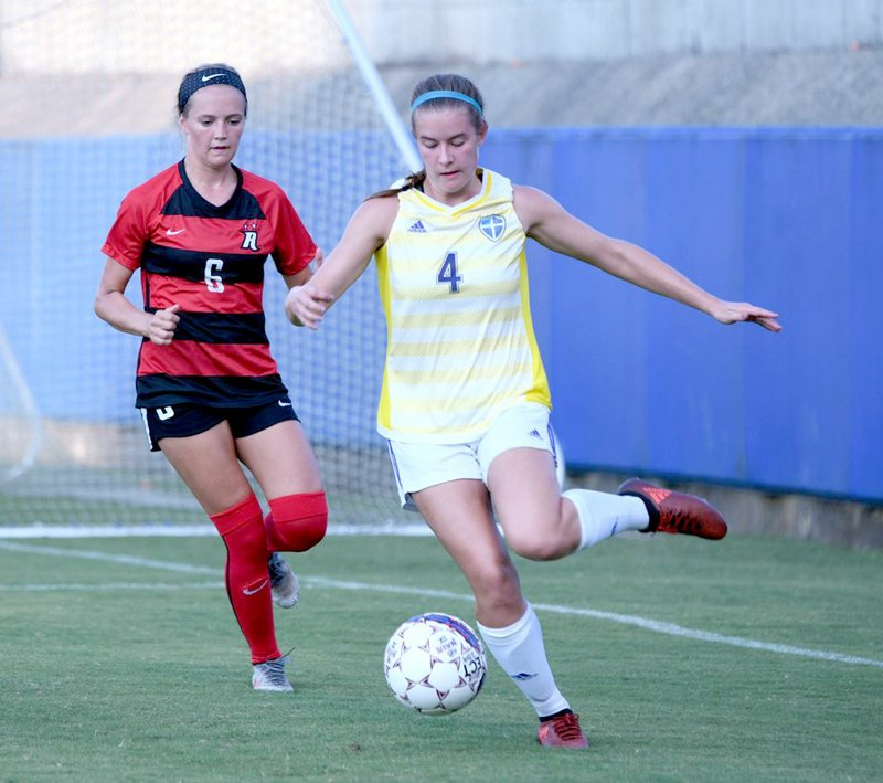 Photo courtesy of Lindsey Wilson College John Brown freshman Paige Martin possesses the ball during Thursday's soccer match against Martin Methodist in a match played at Lindsey Wilson College in Columbia, Ky.