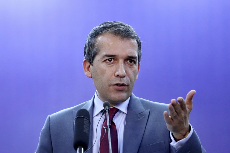 Afghan Presidential Spokesman Sediq Seddqi gives a press conference in Kabul, Afghanistan, Saturday, Sept. 14, 2019. Seddqi said that the priority for his government is to hold national elections later this month - rather than reach a peace deal with insurgents. (AP Photo/Ebrahim Noroozi)