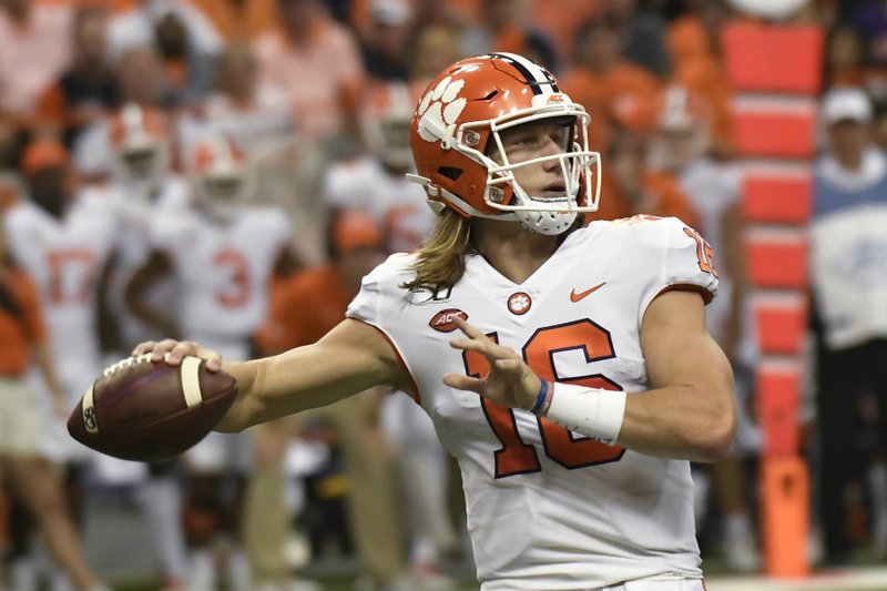 Clemson quarterback Trevor Lawrence throws a touchdown pass against Syracuse during the first half of an NCAA college football game Saturday, Sept. 14, 2019, in Syracuse, N.Y. (AP Photo/Steve Jacobs)