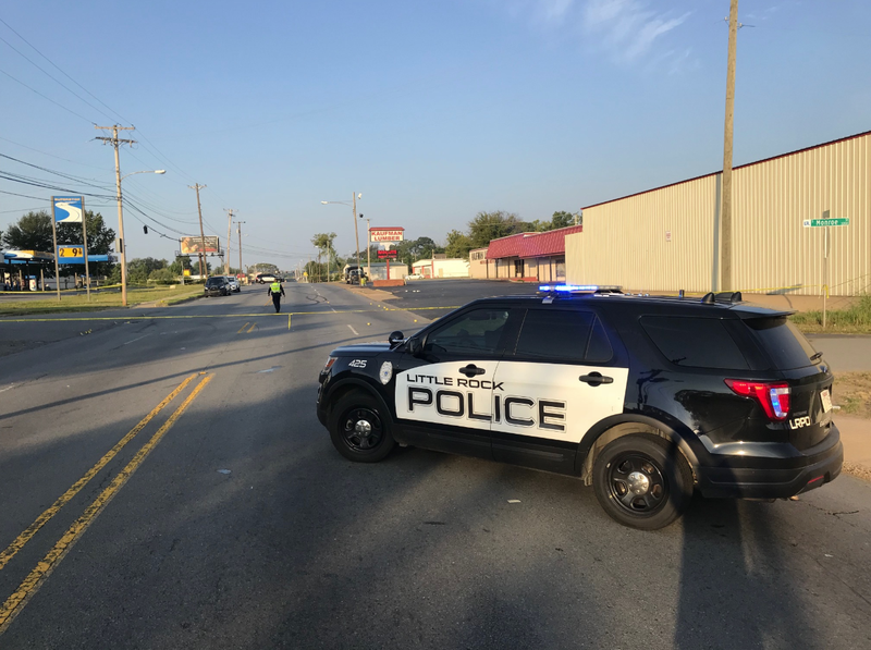 A police SUV blocks a portion of Asher Avenue in Little Rock following a shooting early Sunday that authorities said killed one man and critically injured another person. 