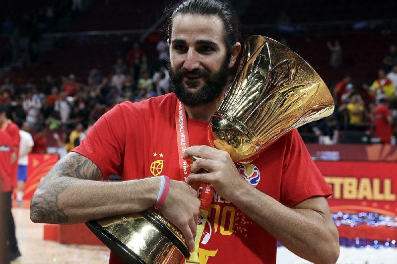 Ricky Rubio holds the Naismith Trophy after scoring 20 points and winning MVP honors in helping Spain defeat Argentina 95-75 for the FIBA World Cup championship on Sunday.