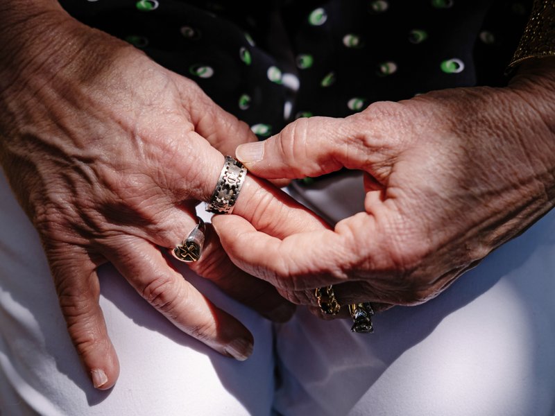 The New York Times/CHRISTOPHER LEE Deborah Huffman touches a ring she wears that doubles as a fidget spinner and helps with her skin-picking disorder, at her home in Dripping Springs, Texas.