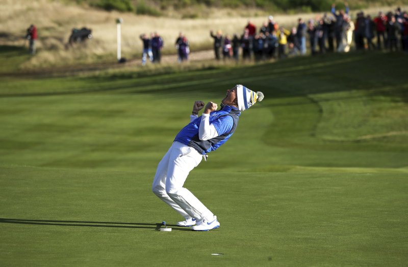 Suzann Pettersen of Europe celebrates after holing a putt on the 18th green to win the Solheim cup against the US at Gleneagles, Auchterarder, Scotland, Sunday, Sept. 15, 2019. (Jane Barlow/PA via AP)