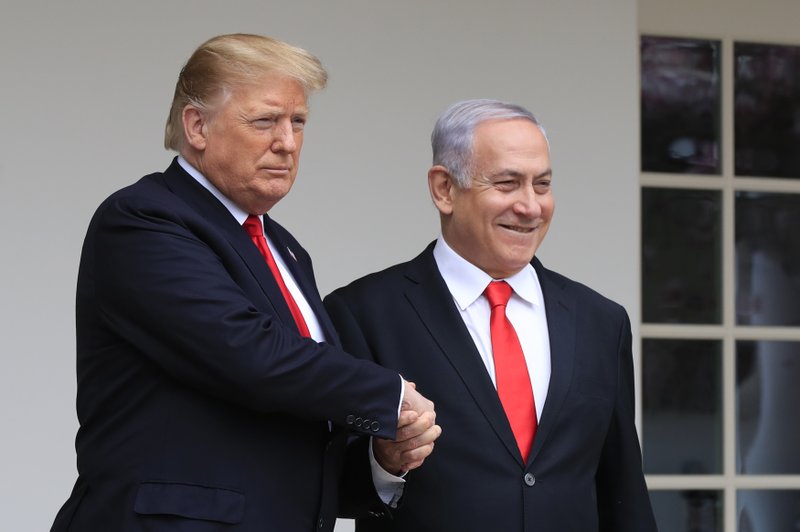 FILE - In this March 25, 2019 file photo, President Donald Trump welcomes visiting Israeli Prime Minister Benjamin Netanyahu to the White House in Washington. Netanyahu, locked in a razor tight race and facing the likelihood of criminal corruption charges, a decisive victory in Tuesday, Sept. 17, vote may be the only thing to keep him out of the courtroom. (AP Photo/Manuel Balce Ceneta, File)