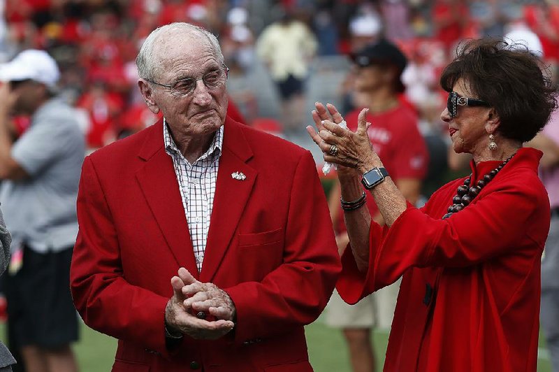 Former head Georgia football coach and athletic director Vince Dooley and his wife Barbara react during a ceremony to name the field at Sanford Stadium in his honor before an NCAA college football game against the Murray State Saturday, Sept. 7, 2019, in Athens, Ga.