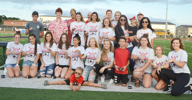 TIMES photograph by Annette Beard Pea Ridge Blackhawk track teams received their state rings before the first home football game in recognition of their state championship this past year.