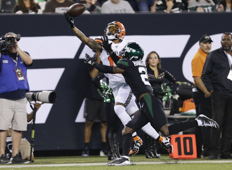 The Associated Press GRABBING A PASS: Cleveland Browns' Odell Beckham (13) catches a pass in front of New York Jets' Nate Hairston (21) during the first half of Monday's game in East Rutherford, N.J.