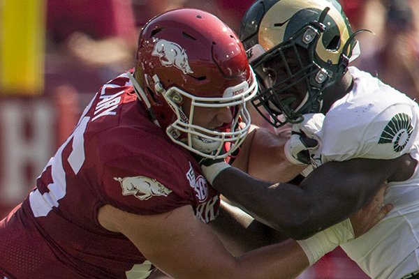 Arkansas center Ty Clary blocks a Colorado State defender during a game Saturday, Sept. 14, 2019, in Fayetteville. 