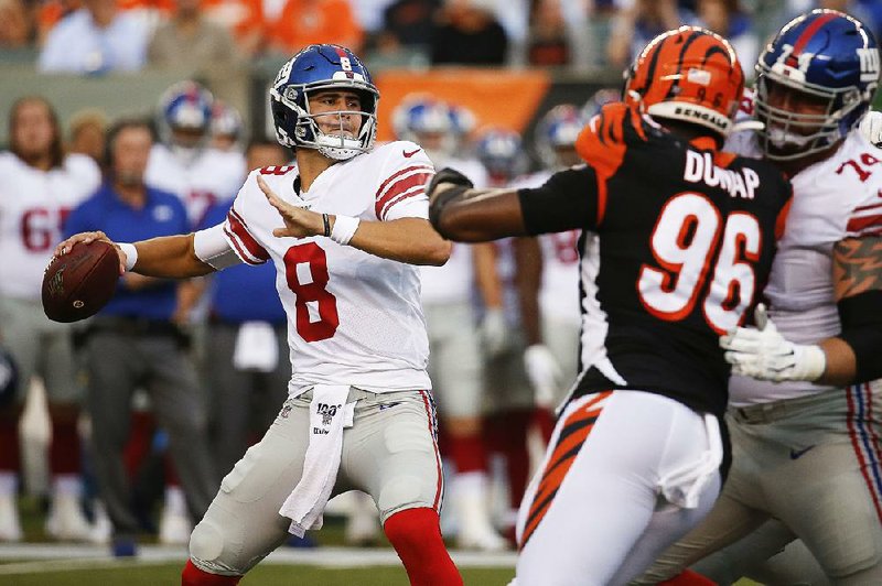 In this Aug. 22, 2019, file photo, New York Giants quarterback Daniel Jones (8) looks for a receiver during the first half of an NFL preseason football game against the Cincinnati Bengals in Cincinnati.
