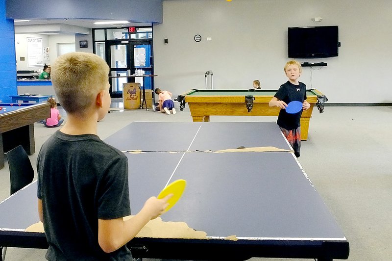 Lynn Atkins/The Weekly Vista Harrison Pattengill gets ready to return a shot duing a ping pong game at the Bella Vista unit of the Boys &amp; Girls Club on Thursday.