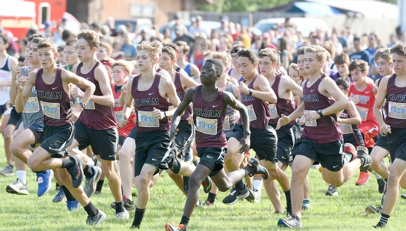 Bud Sullins/Special to the Herald-Leader The Siloam Springs junior high boys finished first in the large schools division of the Panther Cross Country Classic on Saturday on the grounds of Simmons Foods. The Panthers were led by first place overall finisher Noah Granderson, middle, who ran a two-mile time of 11 minutes 10.92 seconds.