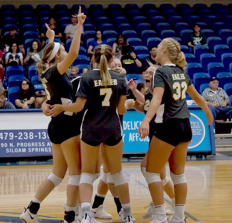 Photo courtesy of JBU Sports Information The John Brown University volleyball team celebrates after scoring a point Saturday against Texas Wesleyan at Bill George Arena. The Golden Eagles swept the Rams 3-0.
