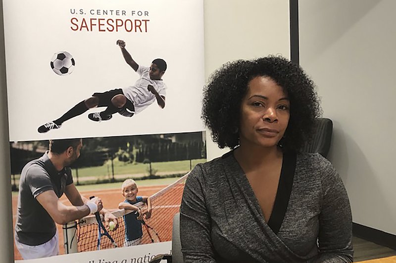 The Associated Press EXCESS CASELOAD: Ju'Riese Colon, the CEO for the U.S. Center for SafeSport, talks about the challenges facing her organization at their headquarters in Denver, Monday, Sept. 16, 2019. The center is receiving 55 percent more sex-abuse reports this year than in 2018, leading to a debate over whether the Olympic movement or federal government should shoulder the increasing cost of keeping athletes safe.
