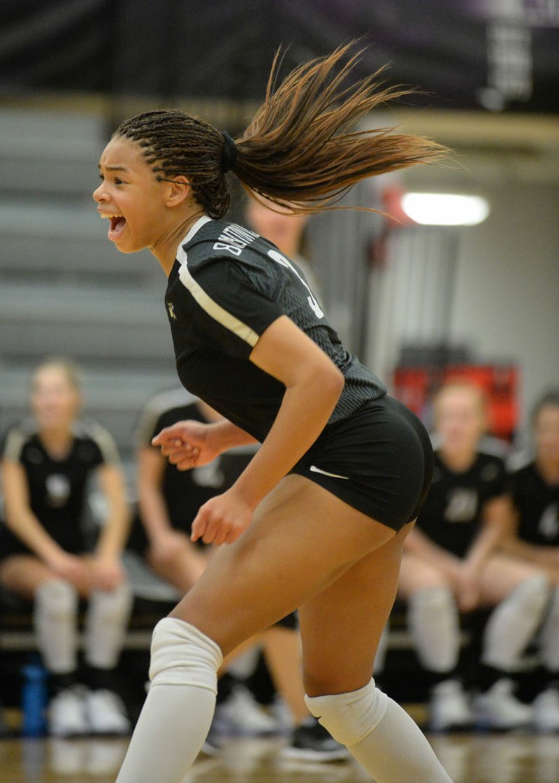 NWA Democrat-Gazette/ANDY SHUPE Bentonville's Trinity Hamilton celebrate Tuesday, Sept. 17, 2019, the final point of the Tigers' second-game win over Fayetteville during play in Bulldog Arena in Fayetteville. Visit nwadg.com/photos to see more photographs from the match.