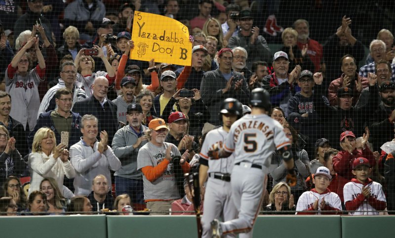 The Associated Press FOR HIS GRANDFATHER: Fans cheer after a solo home run by San Francisco Giants' Mike Yastrzemski (5) in the fourth inning of Tuesday's game against the Boston Red Sox at Fenway Park in Boston. Yastrzemski is the grandson of Red Sox great and Hall of Famer Carl Yastrzemski. (AP Photo/Charles Krupa)