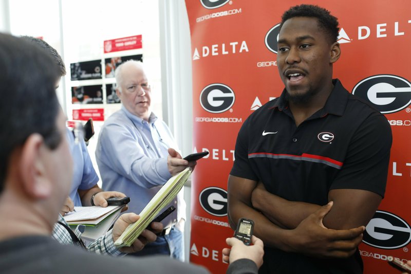 FILE - In this March 19, 2019, file photo, Georgia defensive back J.R. Reed speaks with the media on the first day of spring NCAA college football practice in Athens, Ga. Reed plays for one of the nation&#x2019;s powerhouse programs, where the competition begins as soon as you step on campus. No. 3 Georgia face No. 7 Notre Dame on Saturday. (Joshua L. Jones/Athens Banner-Herald via AP, File)
