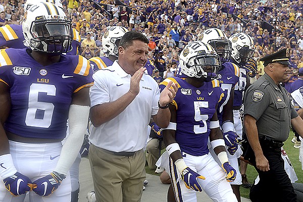 LSU head football coach Ed Orgeron leads his players onto the field before LSU's 65-14 NCAA football game victory over Northwestern State Saturday in Baton Rouge, La., September 14,2019. Photo/Patrick Dennis)


