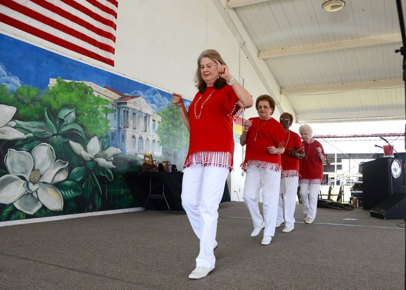 The Silver Belles of Springhill, La., dance to “Blame It On The Bossa Nova” Tuesday at the Columbia County Fair and Livestock show's Senior Citizen's Day festivities. Pictured (front to back) are Christine Snider, Lois Triplet, Vila Mae Dennis, and Nerlene Craighead. 