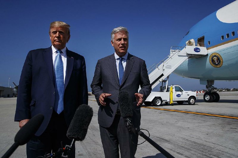 President Donald Trump and new national security adviser Robert O’Brien speak with reporters Wednesday before boarding Air Force One in Los Angeles. O’Brien said he would counsel Trump on Saudi Arabia and Iran in private. 