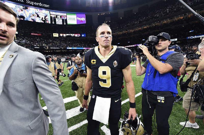 New Orleans Saints quarterback Drew Brees (9) walks on the field after an NFL football game against the Houston Texans in New Orleans, Monday, Sept. 9, 2019. 