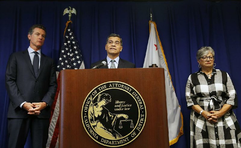 California Attorney General Xavier Becerra, center, flanked by Gov. Gavin Newsom, left, and California Air Resources Board Chair Mary Nichols, discusses the Trump administration's pledge to revoke California's authority to set vehicle emissions standards that are different than the federal standards, during a news conference in Sacramento, Calif., Wednesday, Sept. 18, 2019.  “Our message to those who claim to support states’ rights is, ‘Don’t trample on ours,’” California Attorney General Xavier Becerra said Wednesday. “We cannot afford to backslide in our battle against climate change.” 
