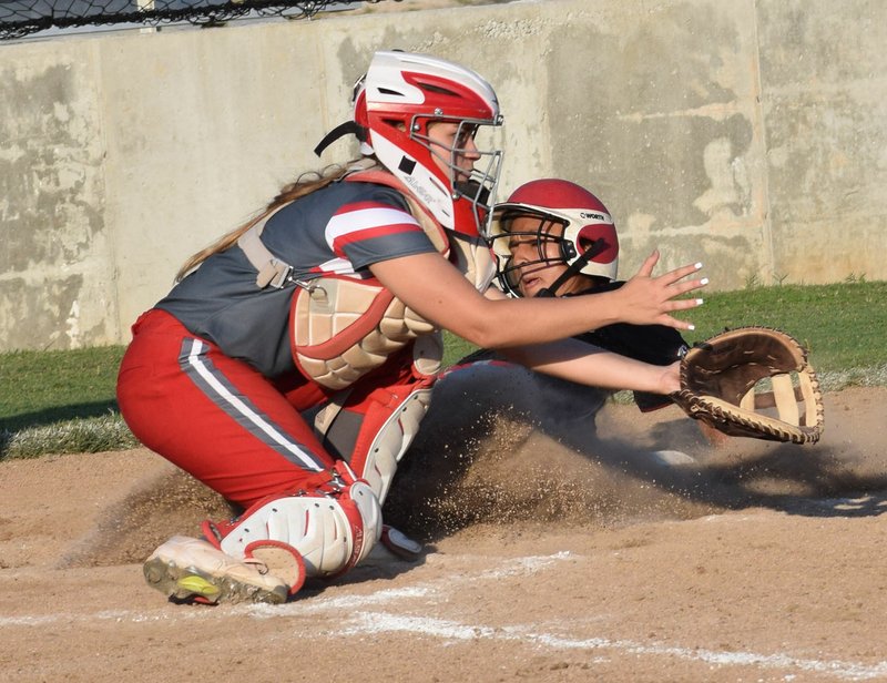 RICK PECK/SPECIAL TO MCDONALD COUNTY PRESS McDonald County's Rita Santillan beats a throw to the plate for an inside-the-park home run during the Lady Mustangs' 7-0 win over Reeds Spring on Sept. 10 at MCHS.
