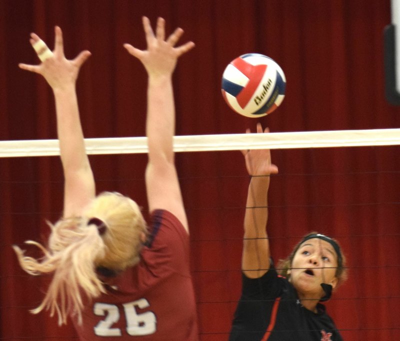 RICK PECK/SPECIAL TO MCDONALD COUNTY PRESS McDonald County's Sosha Howard hits a spike during the Lady Mustangs' 25-15, 25-20 loss to Joplin on Sept. 10 at MCHS.