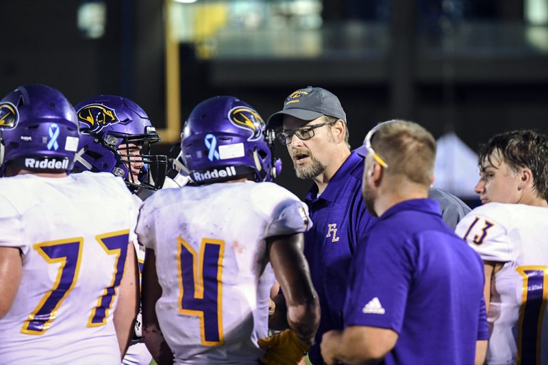 Fountain Lake head football coach Kenny Shelton speaks to his players during a timeout in a game at Lakeside in September 2019. - Photo by Grace Brown of The Sentinel-Record