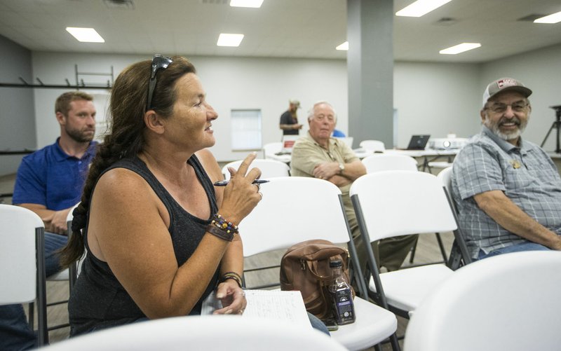 NWA Democrat-Gazette/BEN GOFF  @NWABENGOFF Anita Young, a rural mail carrier from the Sulphur Springs area, talks Wednesday about issues with county roads on her route during a meeting with Benton County Judge Barry Moehring at the Gravette Civic Center.