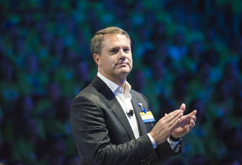  In this file photo Doug McMillon, president and CEO of Walmart Inc., speaks during the annual Walmart shareholders meeting, Friday, June 1, 2018 at Bud Walton Arena in Fayetteville. McMillon said Walmart had been asked to make portions of its store parking lots available in specific locations with the intention of scaling up over time as supplies of the coronavirus tests become more readily available.
(NWA Democrat-Gazette/CHARLIE KAIJO)