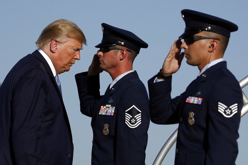 President Donald Trump boards Air Force One at Marine Corps Air Station Miramar, Wednesday, Sept. 18, 2019, in San Diego, Calif. (AP Photo/Evan Vucci)