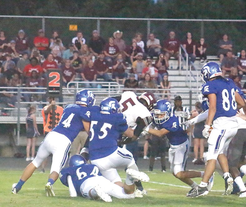 Caleb Slinkard/News-Times Parkers Chapel defenders tackle a Foreman runner during the Trojans’ game last Friday at Victor Nipper Stadium. PC takes on Mayflower tonight. Game time is set for 7 p.m.