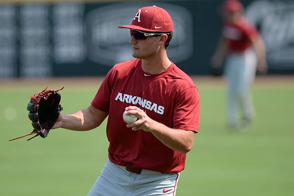 Arkansas pitcher Hunter Milligan warms up Friday, Sept. 6, 2019, during practice at Baum-Walker Stadium in Fayetteville.