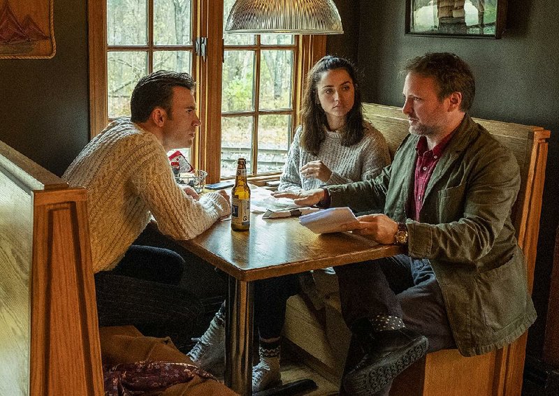 Chris Evans (left) stars with Ana de Armas in director Rian Johnson’s Knives Out.