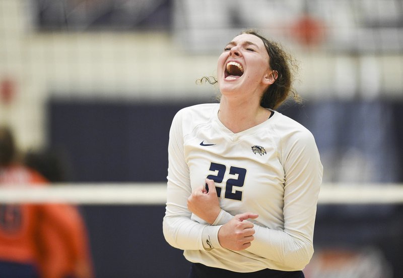 NWA Democrat-Gazette/CHARLIE KAIJO Bentonville West High School middle blocker Kortney Puckett (22) reacts after a score during a volleyball game, Thursday September 19, 2019 at Bentonville West in Centerton.