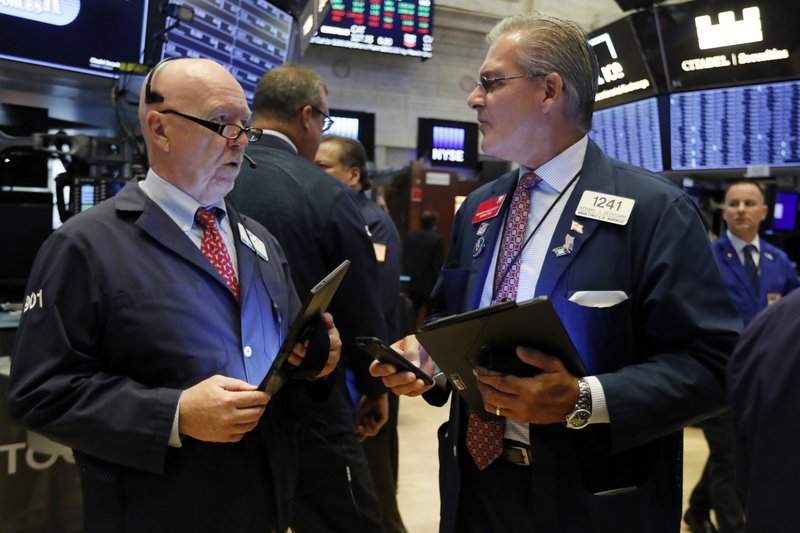 In this Sept. 4, 2019, file photo traders John Doyle, left, and Richard Deviccaro work on the floor of the New York Stock Exchange.  (AP Photo/Richard Drew, File)
