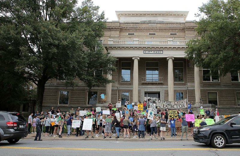 A crowd gathers Friday morning on the steps of City Hall in Little Rock for a climate-change rally. More photos are available at arkansasonline.com/921climaterally/ 