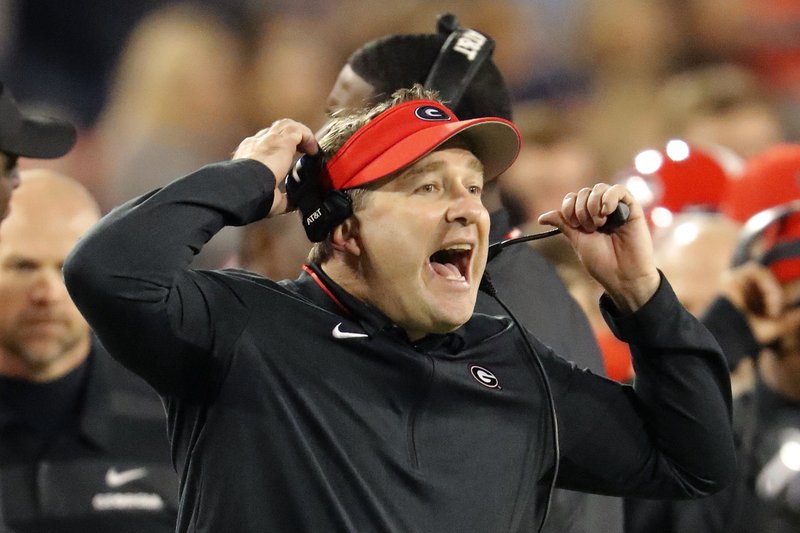 FILE - In this Nov. 17, 2018, file photo, Georgia head coach Kirby Smart reacts on the sideline during the second half of an NCAA college football game against Massachusetts in Athens, Ga. Notre Dame and Georgia. Two of college football's most storied programs meet for the first time in one of its most famed settings, a game that already feels special because of its historic ramifications but is also likely to have a huge impact on this year's race to the College Football Playoff. (AP Photo/John Bazemore, File)